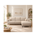 A light beige sectional sofa with a chaise lounge in a bright, modern living room with warm neutral tones, a round wooden coffee table, and a large window.